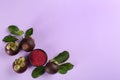 Mangosteen powder and fruits on violet, flat lay. Space for text