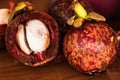 Mangosteen ,Garcinia Mangostana, a tropical fruit that sweet, juicy, on wooden table