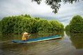 Mangrove forest with fishing boat in Ca Mau province, Mekong delta, south of Vietnam Royalty Free Stock Photo