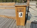 Wooden dust bin or recycling bin in a park, Abudhabi,UAE. Royalty Free Stock Photo