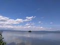 rows of clouds soar over the land of the sea