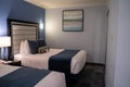 Typical two bed hotel room with queen size beds and modern decor at a Best Western