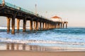 Manhattan Beach pier with ocean waves, Los Angeles, California Royalty Free Stock Photo