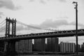 Manhattan bridge, buildings and light pole in black and white Royalty Free Stock Photo