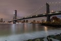 Manhattan Bridge at night as seen from Brooklyn Bridge Park. Royalty Free Stock Photo