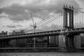Manhattan bridge over the river and the city in black and white style Royalty Free Stock Photo
