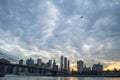 Manhattan Downtown Financial District Skyline and Brooklyn Bridge as Seen from Mainstreet Park in Brooklyn at Sunset