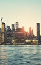 Manhattan East River waterfront silhouette at sunset, color toned picture, New York, USA