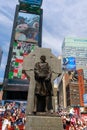 The statue of Father Duffy with street signs in Times Square, New York City