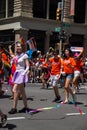 Manhattan, New York, June, 2017: orange shirt group and fancy costume in The Gay Pride Parade