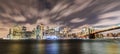 Manhattan panoramic skyline at night with Brooklyn Bridge. Royalty Free Stock Photo