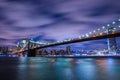 Manhattan panoramic skyline at night with Brooklyn Bridge. Royalty Free Stock Photo