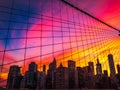 Manhattan skyline through Brooklyn Bridge at sunset Royalty Free Stock Photo