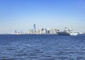 Manhattan skyline with a warship from Staten Island