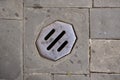 Manhole Cover On Cobbled Road Royalty Free Stock Photo