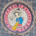 Manhole Cover displayed `Yumomi` - a traditional way to cool down Kusatsu`s hot spring water