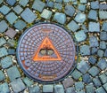 Manhole cover of the gas pipeline system. A massive metal hatch for access to city communications in the pavement