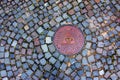 Manhole cover of the gas pipeline system. A massive metal hatch for access to city communications in the pavement