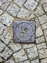 Manhole cover of the gas pipeline system. A massive metal hatch for access to city communications in the pavement