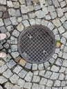 Manhole cover of the gas pipeline system. A massive metal hatch for access to city communications in the pavement