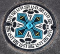 Manhole cover with Ninja star design