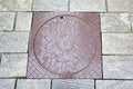 Manhole cover and pavement paving made of natural stone