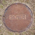 Manhole cover sewer access rust