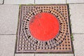 A manhole cover in the street Royalty Free Stock Photo