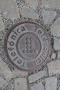 A manhole cover for the telephone utility company in Spain. Telefonica is the name of the main Spanish telephone company