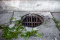 Manhole with the handmade metal armature cover Royalty Free Stock Photo