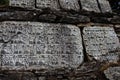 Mani Stones of Buddhism with mantra in Nepal Royalty Free Stock Photo