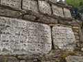 Mani Stones of Buddhism with mantra in Nepal Royalty Free Stock Photo