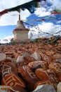 Mani stones and Buddhist stupa Royalty Free Stock Photo