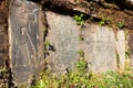 Mani wall and stones with buddhist symbols Royalty Free Stock Photo