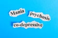 Mania co-depressive psychosis text on paper. Word Mania co-depressive psychosis on a piece of paper. Concept Image. Mania co-depre Royalty Free Stock Photo