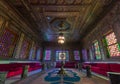 Manial Palace of Prince Mohammed Ali. Syrian Hall with ornate wooden walls and windows with colored stained glass, Cairo, Egypt