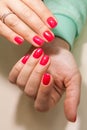 Manicure - Beauty treatment photo of nice manicured woman fingernails with red nail polish Royalty Free Stock Photo