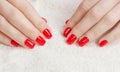 Manicure - Beauty treatment photo of nice manicured woman fingernails with red nail polish. Royalty Free Stock Photo