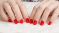 Manicure - Beauty treatment photo of nice manicured woman fingernails with red nail polish. Royalty Free Stock Photo