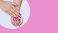 Manicure - Beauty treatment photo of nice manicured woman fingernails. Very interesting nail art with glitter light pink, pink and Royalty Free Stock Photo