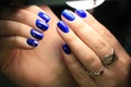 Manicure blue stained glass gel polish with a picture Royalty Free Stock Photo