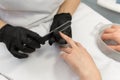 Manicure. Close-up Of Female Hands Filing Nails With Nail File In Beauty Salon. Closeup Of Beautiful Woman Hand With Royalty Free Stock Photo