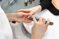 Manicure. Close-up Of Female Hands Filing Nails With Nail File In Beauty Salon. Closeup Of Beautiful Woman Hand With Royalty Free Stock Photo