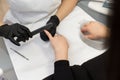 Manicure. Close-up Of Female Hands Filing Nails With Nail File In Beauty Salon. Royalty Free Stock Photo