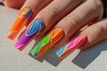 Manicure closeup. Woman bright nails close-up. Nail care in beauty salon. Spa healthy treatments for female hands. Fashion bright
