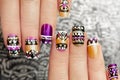 Manicure with colorful ethnic design.