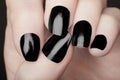 Manicure on female hands with black nail polish Royalty Free Stock Photo