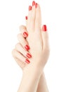 Manicure on female hands with red nail polish Royalty Free Stock Photo