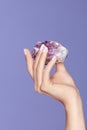 Manicure. Hand With Stylish Nails Holding Purple Gemstone