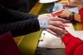 Woman in a nail salon receiving a manicure by a beautician . Manicure process in beautiful salon . Closeup of Woman applying nail Royalty Free Stock Photo